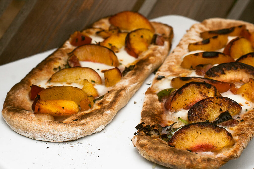 Grilled Peach Pizzas on a plate.