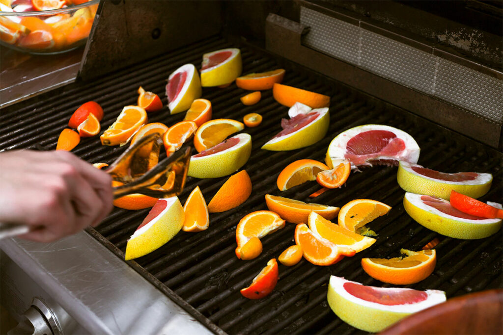 Oranges being grilled.