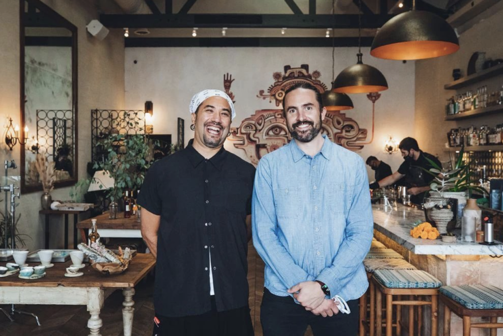Chef Joshua Gil and partner of MÍRAME standing together at restaurant.