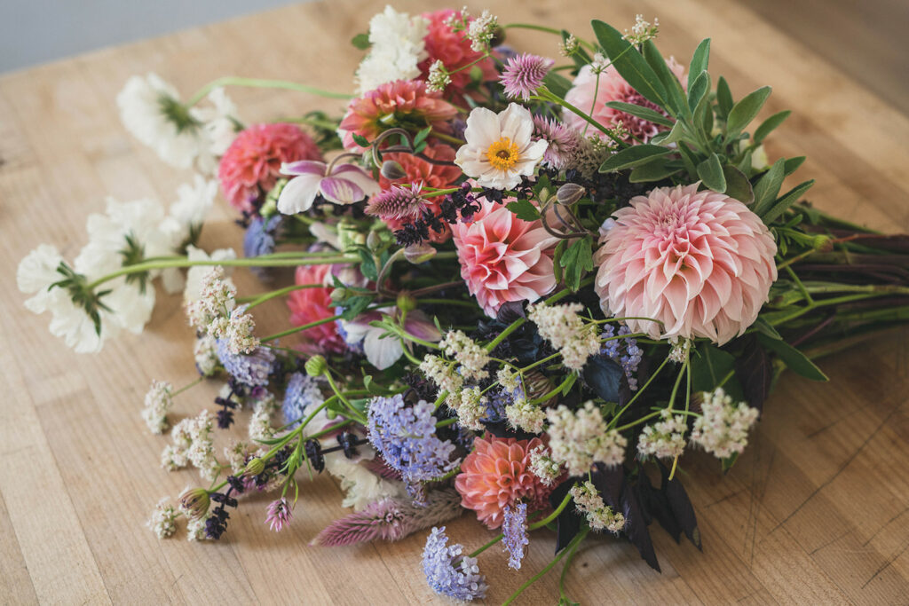 Fresh organic flowers on a wooden table.