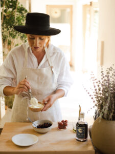 Chef Camilla Marcus cooking in her kitchen.