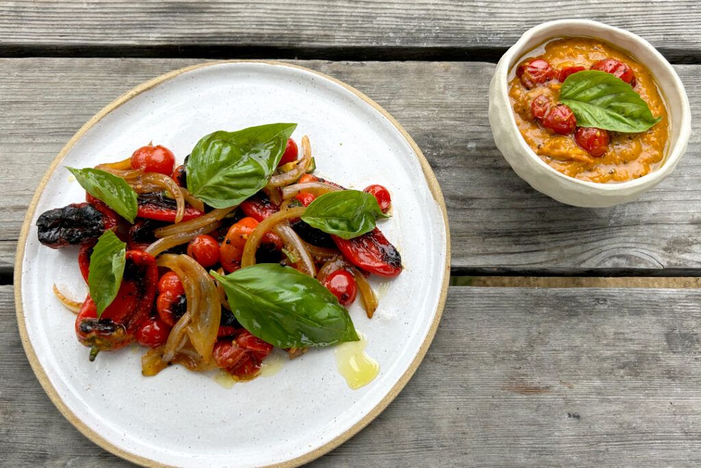 Indulge in a vibrant Roasted Vegetable Medley, featuring tender onions, cherry tomatoes, and zucchini, beautifully complemented by charred lunchbox peppers. This dish is elevated with a side of Sungold Tomato Sauce, making it a versatile and flavorful choice.